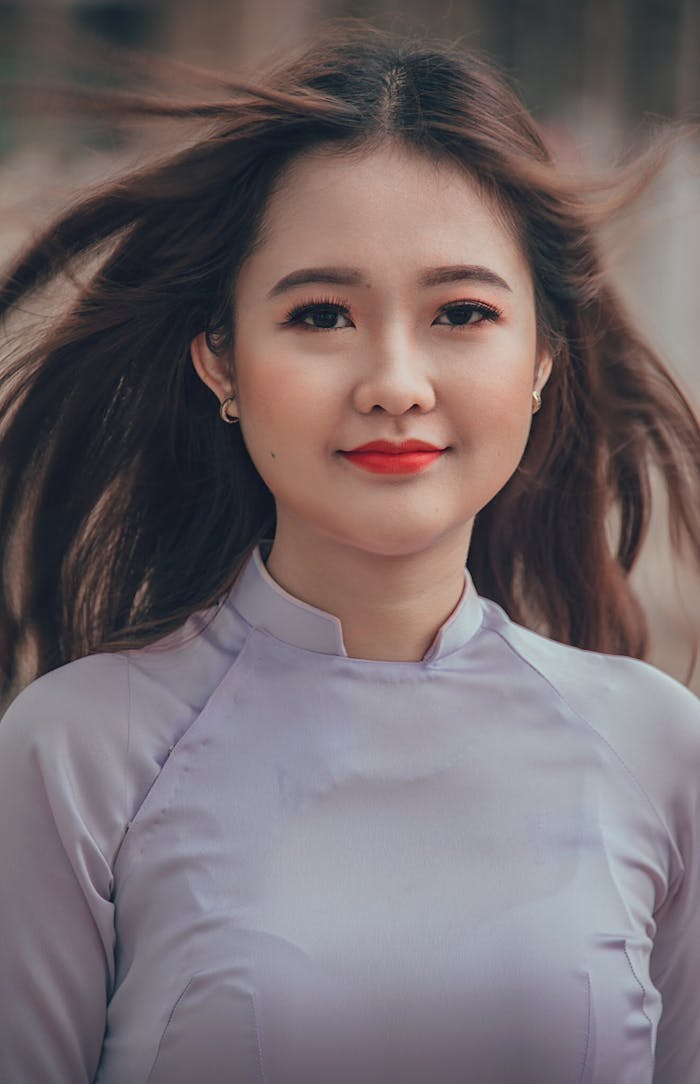 Woman Wearing White Long-sleeved Shirt Selective Focal Photo